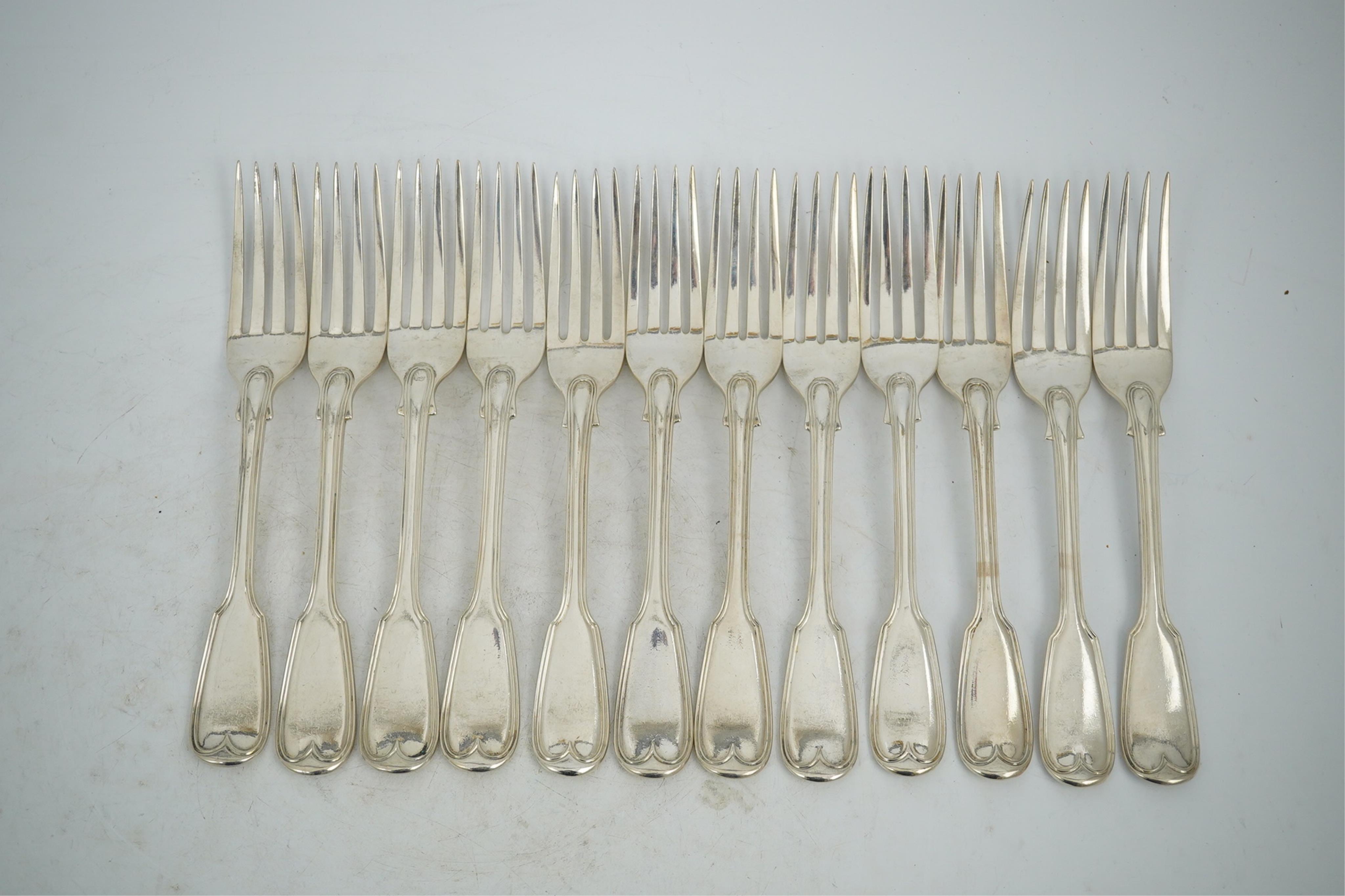 A set of twelve William IV silver double struck fiddle and thread pattern table forks, William Chawner II, London, 1831, 34.2oz.